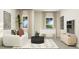 Stylish living room featuring a modern sofa, round coffee table, and a foosball table for entertainment at 712 Swim Cave Ln, Wendell, NC 27591