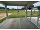 Covered screened porch provides an outdoor living space overlooking backyard and lush lawn at 712 Swim Cave Ln, Wendell, NC 27591