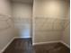 Spacious walk-in closet with built-in wire shelving for optimal organization and storage capabilities at 712 Swim Cave Ln, Wendell, NC 27591