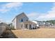 Spacious backyard with a covered patio, offering ample space for outdoor activities and entertaining at 724 Summer Music Ln, Raleigh, NC 27603