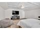 Cozy bedroom featuring a large TV, comfortable seating, and hardwood floors for relaxation and entertainment at 724 Summer Music Ln, Raleigh, NC 27603