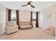 Inviting Bedroom featuring a crib, plush rocking chair, and soft lighting for a peaceful retreat at 724 Summer Music Ln, Raleigh, NC 27603