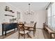 Elegant dining room with a wooden table, stylish chandelier, and decor at 724 Summer Music Ln, Raleigh, NC 27603