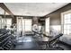 Community gym featuring modern equipment, mirrored walls, and natural light at 724 Summer Music Ln, Raleigh, NC 27603