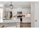 Bright kitchen featuring white cabinets, stainless steel appliances, and modern fixtures at 724 Summer Music Ln, Raleigh, NC 27603
