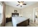 Bedroom with plush carpeting, complemented by a ceiling fan and modern lighting at 73 Vibernum Vw, Four Oaks, NC 27524