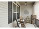 Charming covered front porch featuring comfortable seating and decor at 73 Vibernum Vw, Four Oaks, NC 27524