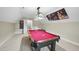 Entertainment room featuring a pool table, dartboard, and unique wall art for fun and relaxation at 73 Vibernum Vw, Four Oaks, NC 27524