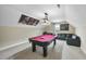 Game room featuring a pool table, leather couch, desk, and unique wall art for entertainment at 73 Vibernum Vw, Four Oaks, NC 27524