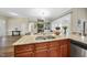 The kitchen features stainless steel appliances, granite countertops, and wood cabinets with stainless steel hardware at 73 Vibernum Vw, Four Oaks, NC 27524