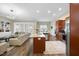 Open concept kitchen with granite counters, stainless appliances and a large island at 73 Vibernum Vw, Four Oaks, NC 27524