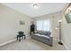 Cozy living room features a plush couch, side table with plant, and a lamp for a comfortable ambiance at 73 Vibernum Vw, Four Oaks, NC 27524