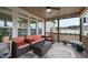 Inviting screened-in porch with comfortable seating, ceiling fan, and view of the backyard at 73 Vibernum Vw, Four Oaks, NC 27524