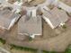 Birds-eye view of home, driveway and landscaping in a well-maintained neighborhood at 734 Hornchurch Loop, Cary, NC 27519