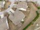 Real estate aerial view highlighting backyard landscaping, the roof and neighborhood layout at 734 Hornchurch Loop, Cary, NC 27519