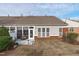 Backyard area featuring a screened in porch and small patio at 734 Hornchurch Loop, Cary, NC 27519