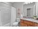 Well-maintained bathroom with granite countertop vanity and shower-tub combination at 734 Hornchurch Loop, Cary, NC 27519