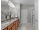 Bathroom with double vanity, granite counters, and walk-in shower at 734 Hornchurch Loop, Cary, NC 27519