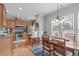 Bright eat-in kitchen with stainless steel appliances, granite countertops, and breakfast bar seating at 734 Hornchurch Loop, Cary, NC 27519