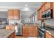 Kitchen featuring stainless steel appliances, granite counters, and eat-through to living area at 734 Hornchurch Loop, Cary, NC 27519