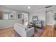 Inviting living room with hardwood floors, ceiling fan, and neutral decor at 734 Hornchurch Loop, Cary, NC 27519
