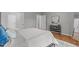 Comfortable main bedroom featuring hardwood floors, ensuite bathroom, and walk-in closet at 734 Hornchurch Loop, Cary, NC 27519