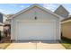 Detached garage with white garage door at 805 Historian St, Raleigh, NC 27603