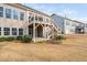 Backyard view featuring a deck with stairs, and mature landscaping creating a serene outdoor space at 832 Mountain Vista Ln, Cary, NC 27519