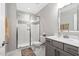 Modern bathroom with a glass-enclosed shower and stylish vanity with white countertop at 832 Mountain Vista Ln, Cary, NC 27519