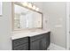 Bathroom featuring grey cabinets with a white countertop, large mirror, and recessed lighting at 832 Mountain Vista Ln, Cary, NC 27519