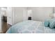A bedroom with a bed, a window, wood floors, and two doors at 832 Mountain Vista Ln, Cary, NC 27519