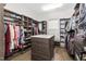 Walk-in closet featuring custom shelving and storage, wood floors, and recessed lighting at 832 Mountain Vista Ln, Cary, NC 27519