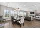 Bright dining room area with coffered ceilings and large windows at 832 Mountain Vista Ln, Cary, NC 27519