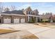 Spacious home with a three-car garage and a sprawling front yard at 832 Mountain Vista Ln, Cary, NC 27519