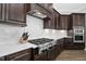 Gourmet kitchen with stainless steel appliances, stone countertops and subway tile backsplash at 832 Mountain Vista Ln, Cary, NC 27519