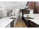 Gourmet kitchen with custom cabinets, a large island, and stainless steel appliances at 832 Mountain Vista Ln, Cary, NC 27519