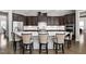 Spacious kitchen featuring a large center island, custom cabinets, and stainless appliances at 832 Mountain Vista Ln, Cary, NC 27519