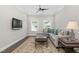 Comfortable living room featuring a sectional sofa, rug, coffee table and windows at 832 Mountain Vista Ln, Cary, NC 27519