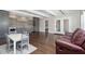 Bright living area featuring hardwood floors, bar, seating area, and coffered ceilings at 832 Mountain Vista Ln, Cary, NC 27519