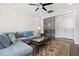 Cozy living room featuring a sectional sofa, rug, coffee table and wood floors at 832 Mountain Vista Ln, Cary, NC 27519