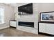 Living room featuring a modern fireplace and custom cabinetry at 832 Mountain Vista Ln, Cary, NC 27519