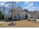 Charming single-story home showcasing a covered porch, brick foundation, and well-manicured lawn at 862 Legacy Falls S Dr, Chapel Hill, NC 27517