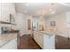 Bright kitchen featuring granite counters, stainless steel appliances, and an island at 862 Legacy Falls S Dr, Chapel Hill, NC 27517