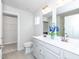 Elegant bathroom with double vanity, modern fixtures, and a separate toilet area at 8630 Kenridge Ln, Fuquay Varina, NC 27526