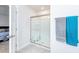 Bathroom showcasing glass-enclosed shower with seat and tiled flooring at 8630 Kenridge Ln, Fuquay Varina, NC 27526