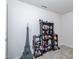 Bedroom with carpet floor featuring a collection of toys displayed on a dark wooden shelf at 8630 Kenridge Ln, Fuquay Varina, NC 27526