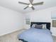 Serene bedroom with plush carpeting, ceiling fan, and neutral color palette at 8630 Kenridge Ln, Fuquay Varina, NC 27526