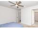 Serene bedroom with plush carpeting, ceiling fan, and neutral color palette at 8630 Kenridge Ln, Fuquay Varina, NC 27526