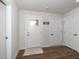 Bright entryway featuring hardwood floors, white trim, and a view of the front door at 8630 Kenridge Ln, Fuquay Varina, NC 27526