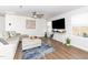 Bright living room with comfortable seating, modern decor, and plenty of natural light at 8630 Kenridge Ln, Fuquay Varina, NC 27526